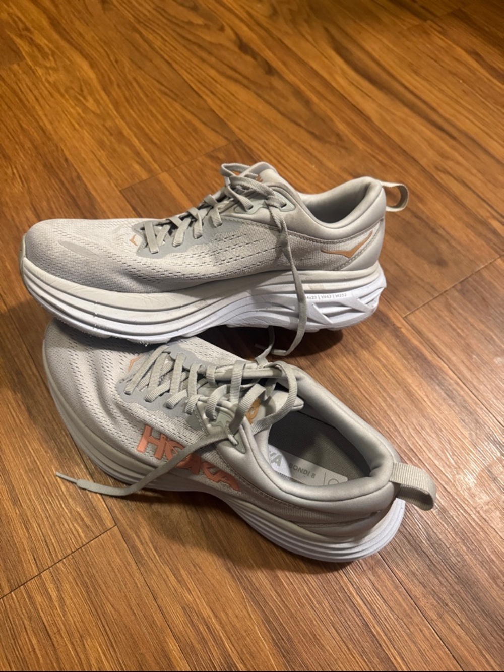 Hoka Bondi 8 Gray Running Sneakers with Peach Accents